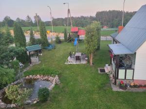 an aerial view of a backyard with a pond and a house at Słabińska Marianna Gospodarstwo Agroturystyczne Willamajka in Rutka Tartak