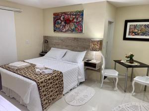 Ένα ή περισσότερα κρεβάτια σε δωμάτιο στο Pousada Pedras Brancas