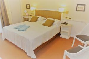 Postel nebo postele na pokoji v ubytování Hotel Garden + 37 fotografií