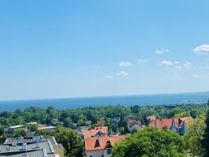 a view of a town with trees and houses at Bay view apartment Mieszkanie z widokiem na zatoke in Sopot