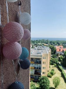a group of balls hanging on the side of a building at Bay view apartment Mieszkanie z widokiem na zatoke in Sopot