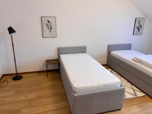 Posteľ alebo postele v izbe v ubytovaní Dobré časy Apartment