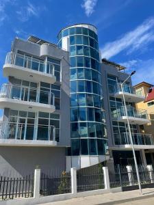 a building with balconies on the side of it at Hotel ECO Palace in Primorsko