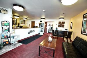 a living room with a couch and a table at Super 8 by Wyndham Elko in Elko