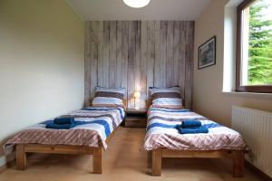 Posteľ alebo postele v izbe v ubytovaní Cze Chill House - Dom na Kaszubach