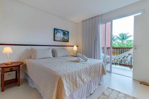 Ένα ή περισσότερα κρεβάτια σε δωμάτιο στο MSP01 Village 3/4, Pé na Areia - Praia da Gamboa
