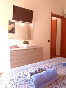 A bed or beds in a room at La Dimora