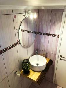 a bathroom with a sink and a mirror at Τequila Sunrise in Áyios Pétros +31 photos