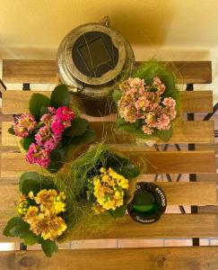 a table with some flowers on top of it at Villa Rina in Pesaro