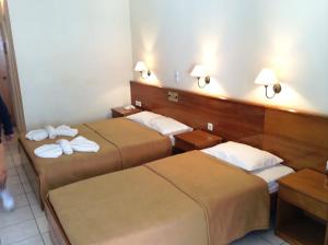Postel nebo postele na pokoji v ubytování Andreolas Beach Hotel