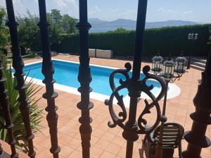 a view from the balcony of a house with a swimming pool at Itxi y Jamin - Chalet con vistas a la Ria de Vigo in Moaña