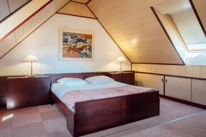 Postel nebo postele na pokoji v ubytování Garni Hotel Miklič
