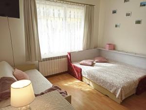 Łóżko lub łóżka w pokoju w obiekcie Domek wypoczynkowy Szczyrk Centrum - Twój Domek