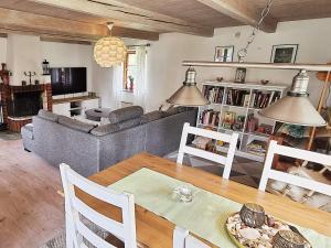 a living room with a couch and a table at 6 person holiday home in L derup in Löderup