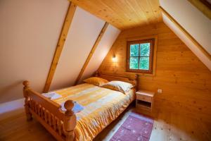 Postel nebo postele na pokoji v ubytování Cottages Kravanja