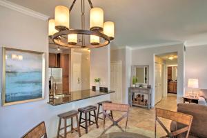 a kitchen and living room with a chandelier at Scottsdale Condo with Pool Walk to Kierland Resort in Scottsdale