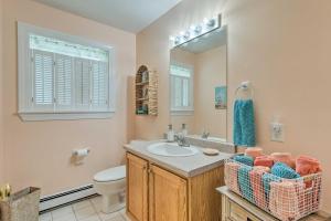 a bathroom with a sink and a toilet and a mirror at South Kingstown Vacation Rental 2 Mi to Beach! in South Kingstown +28 photos