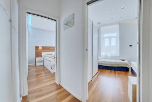 a large mirror in a room with a bedroom at Apartment light in Pula in Pula