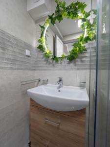 a bathroom with a sink and a mirror at Luxury Boutique Studio in Budva +49 photos