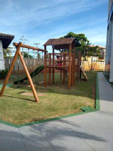 a park with a playground with a swing at BEACH APARTMENT IN VILAS DO ATLANTICO in Lauro de Freitas +24 photos