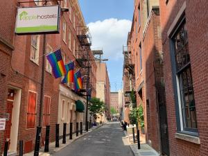 a street in a city with buildings and flags at Apple Hostels of Philadelphia in Philadelphia