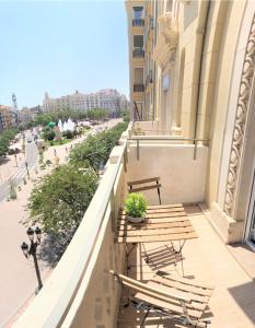 a balcony with a table and chairs on a building at PLAZA VIEW in Valencia