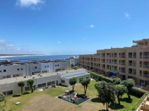 an aerial view of an apartment complex with a park at Beach Front with Rooftop in Vila do Conde