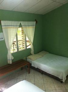 Cama o camas de una habitación en Guest house Posada Ixchel