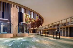 an internal view of a building with a hallway at PARKROYAL COLLECTION Marina Bay, Singapore in Singapore