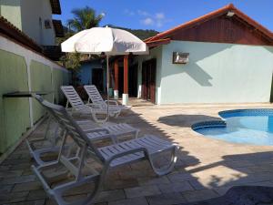 The swimming pool at or close to Casa de praia condominio mar verde