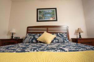 a bedroom with a bed with a pillow on it at Magical Adventure Condo w Waterpark near Disney No Resort Fees in Orlando