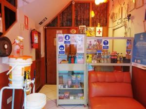 a room with a refrigerator with drinks in it at Hostal Sumak'usi in Juliaca