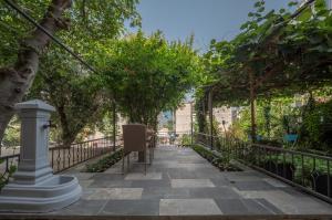 a walkway with trees and a fence at Luxury Boutique Studio in Budva