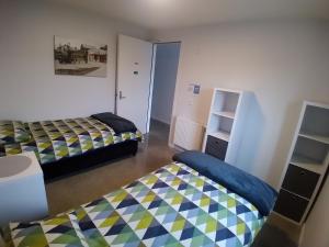 Letto o letti in una camera di Penny's Drop Inn