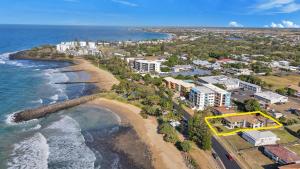 an aerial view of the beach and the ocean at Nautilus Beachside Apartments in Bargara