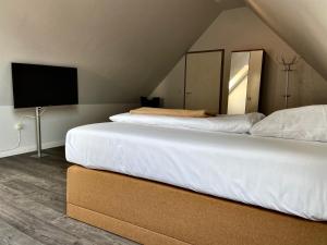 Кровать или кровати в номере Residenz Hotel Neu Wulmstorf