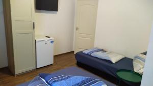 Postel nebo postele na pokoji v ubytování VilLa AdeLe
