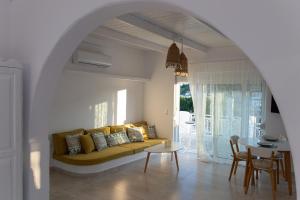 a living room with a couch and a table at Seva's House in Psinthos