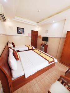 Postel nebo postele na pokoji v ubytování Thanh An Hotel