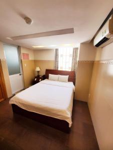 Postel nebo postele na pokoji v ubytování Thanh An Hotel