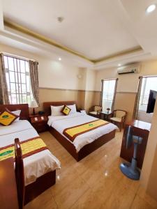 Postel nebo postele na pokoji v ubytování Thanh An Hotel
