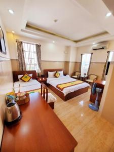 Postel nebo postele na pokoji v ubytování Thanh An Hotel