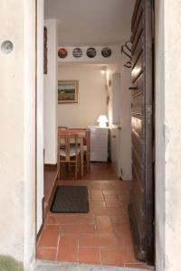 a hallway with a table and a dining room at House in Central Todi with Sensational Views of Surrounding Countryside in Todi