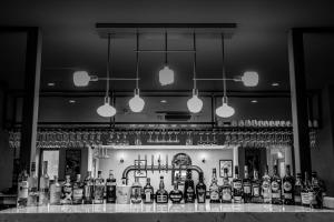 a bar with a lot of bottles of alcohol at Broadcroft Hotel in Kirkintilloch