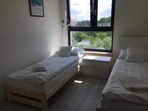 Posteľ alebo postele v izbe v ubytovaní Apartament Kraków Arena No. 100