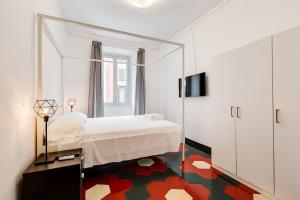 a bedroom with a bed and a large mirror at La casa di Andrea ai Musei Vaticani 1 in Rome