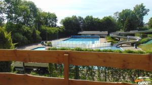 a pool at a park with a slide at Blockhütte am Kegelsberg in Gelenau +17 photos