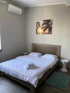 Postel nebo postele na pokoji v ubytování Opera Apart Hotel