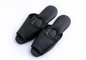 a pair of black flip flops on a white background at APA Hotel Hakata Ekimae 2Chome in Fukuoka