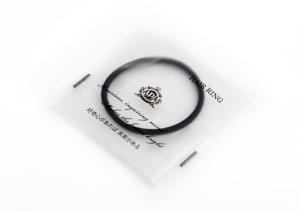 a black ring on top of a white envelope at APA Hotel Hakata Ekimae 2Chome in Fukuoka